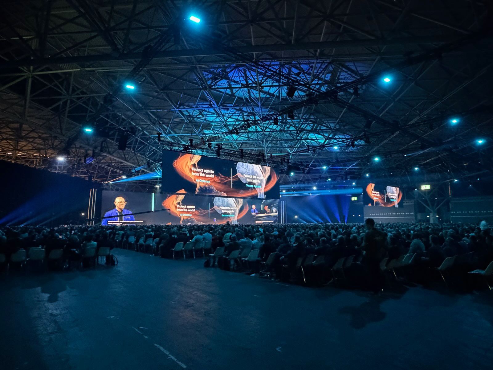 A packed Cisco Live audience watching the main stage